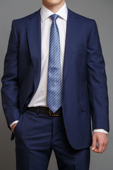 man in blue tuxedo with light blue tie - 138853783