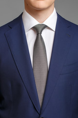 man in blue tuxedo with grey tie - 138853798