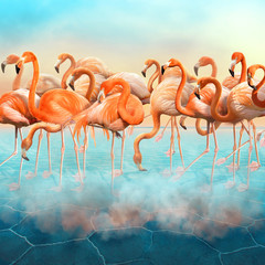 Naklejka premium Compositing with a range of beautiful red flamingo in the blue surreal desert with colorful sunset sky