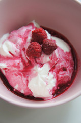 Cream cheese with raspberry and sauce in pink bowl