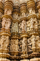 Fototapeta na wymiar Close up of artful ancient carvings, Khajuraho Group of Monuments, India