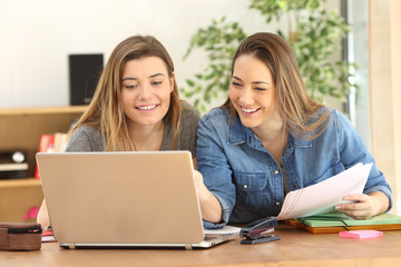 Students studying on line at home