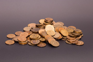 a scattering of coins on a black background