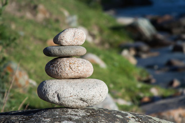 stack of stones in mountain river zen relaxation meditation