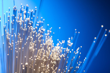 fiber optics on a blue background, abstract light lines