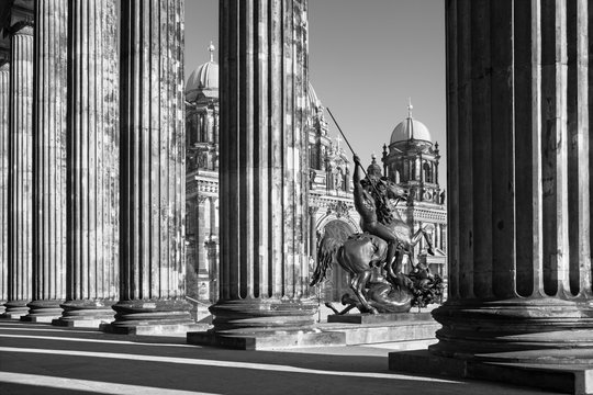 Berlin - The Dom, columns of Altes Museum and the bronze sculpture Lowenkampfer by Albert Wolff and designed by Christian Daniel (1861).