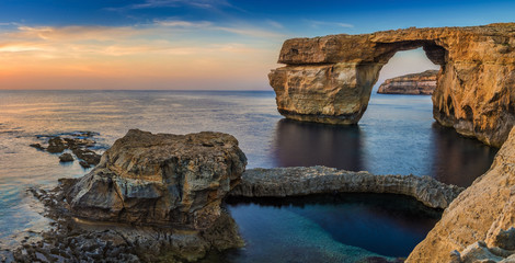 Gozo, Malta - Panoramic view of the beautiful Azure Window, a natural arch and famous landmark on the island of Gozo at sunset