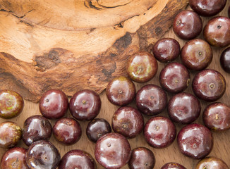 Berry Jaboticaba on wooden table (Plinia cauliflora)