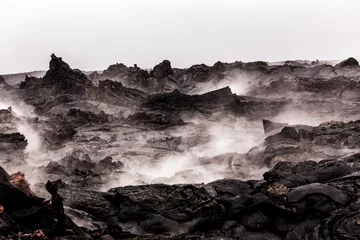 Fototapete Vulkan Steaming lava pieces under light rain