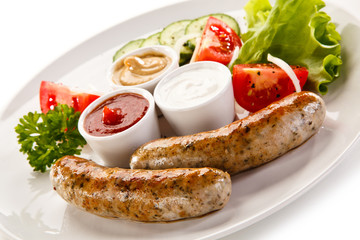 Breakfast - fried white sausages and vegetables 