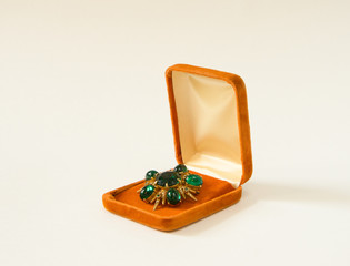 Vintage brooch in a present box on white background. Woman's Jewelry.