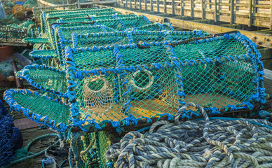 Lobster pots stacked ready for loading onto fishing boats.