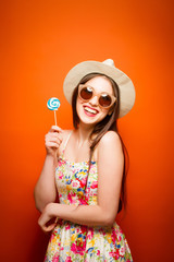 Beautiful smiling woman. Over orange background