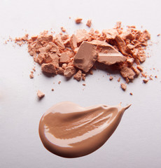 Сrumbled natural powder make up on white background. Face powder texture