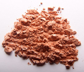 Сrumbled natural powder make up on white background. Face powder texture