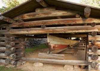 Ancient wooden boat in shed in Petajavesi near old church, Finland