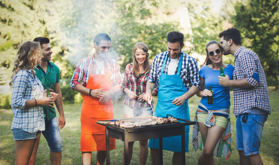 Happy people having camping and having bbq party
