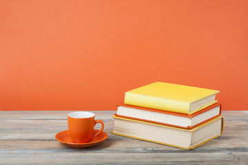 Cup of tea and books on wooden table Education background.Back to school.Copy space for text.