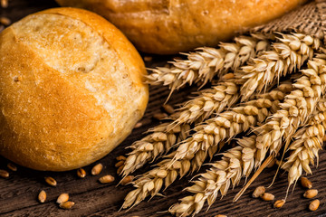Freshly baked traditional bread with honey on a wooden table