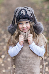 Fototapeta premium child knitted jacket walking