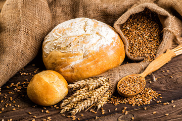 Freshly baked traditional bread with honey on a wooden table