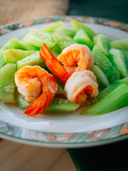 Vintage style Traditional Thai food Stir-fried cucumber with shrimp on top able plan on wooden background wallpaper