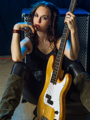 Fototapeta na wymiar Beautiful woman bass player
