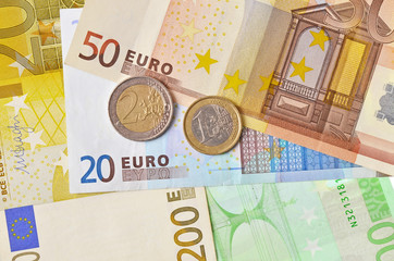 Euro coins on euro banknotes