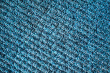 Blue textured tissue background. The pattern on the fabric surface. Pile on a dense and warm material.
