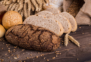 assortment of baked bread on wood table