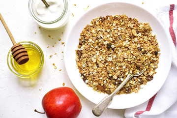 Healthy diet breakfast: granola,fruits,yogurt and honey.Top vie with space for text.