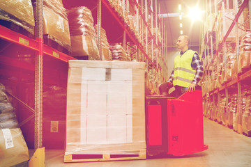 man on forklift loading cargo at warehouse