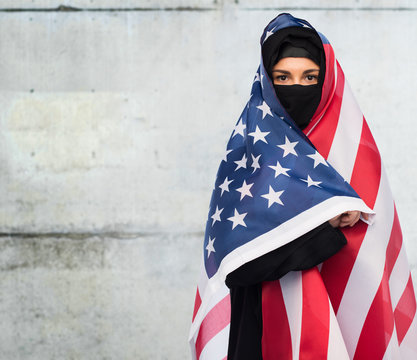 muslim woman in hijab with american flag