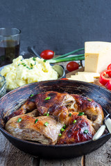 chicken legs  on cast iron pan
