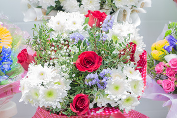 Bunch of large white chrysanthemums and red roses