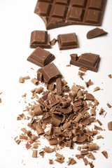 Tablet and chocolate chips on white background. Isolated.