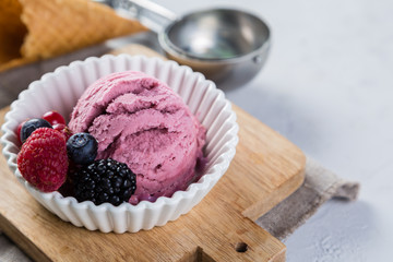 Berry ice cream in white bowl