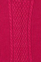 Magenta knitting texture background with cable panel pattern