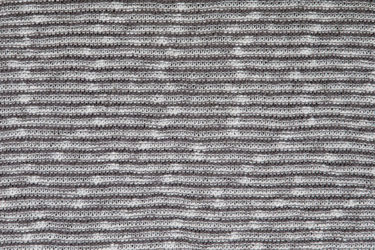 Grey and white knitting wool texture background.