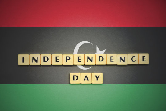 letters with text independence day on the national flag of libya.