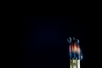 Matches on a dark background