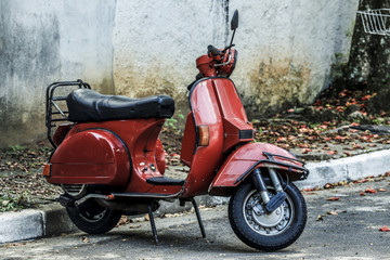 Fototapeta na wymiar red scooter on street