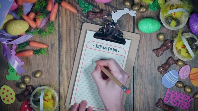 4K Easter Composition Hands Writing Happy Easter