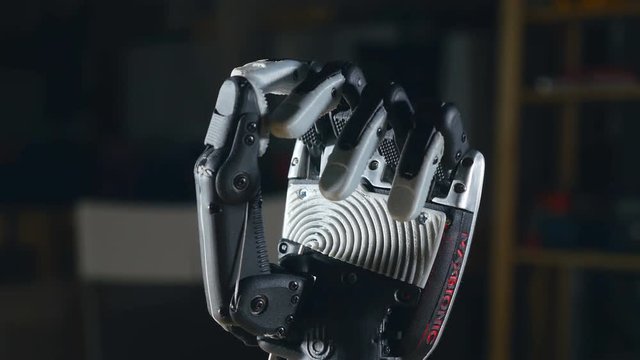 Real innovative bionic cybernetic man gesturing. Futuristic arm moving fingers. 4K.