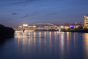Fototapeta na wymiar Old town, riverside, Bratislava castle, Apollo Bridge, UFO Bridge, New Bridge shoot during dusk from above river Danube, Slovakia