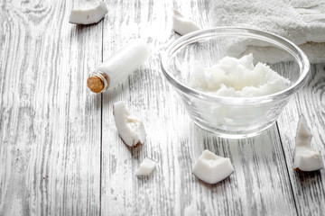 organic cosmetics with coconut on wooden background close up