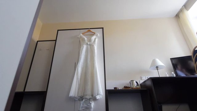 vist wedding dress on hanger
