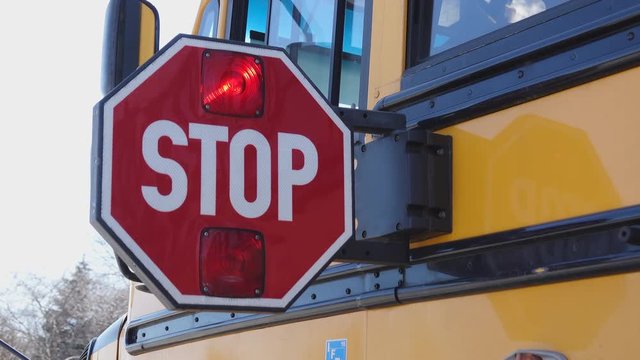 School bus stop paddle being extended