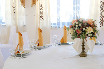 Interior of a cafe with the serviced tables