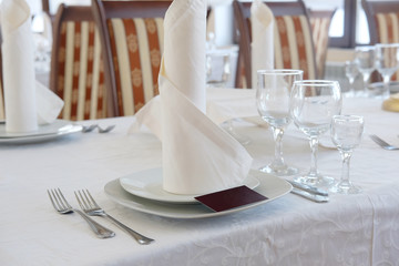 Interior of a cafe with the serviced tables